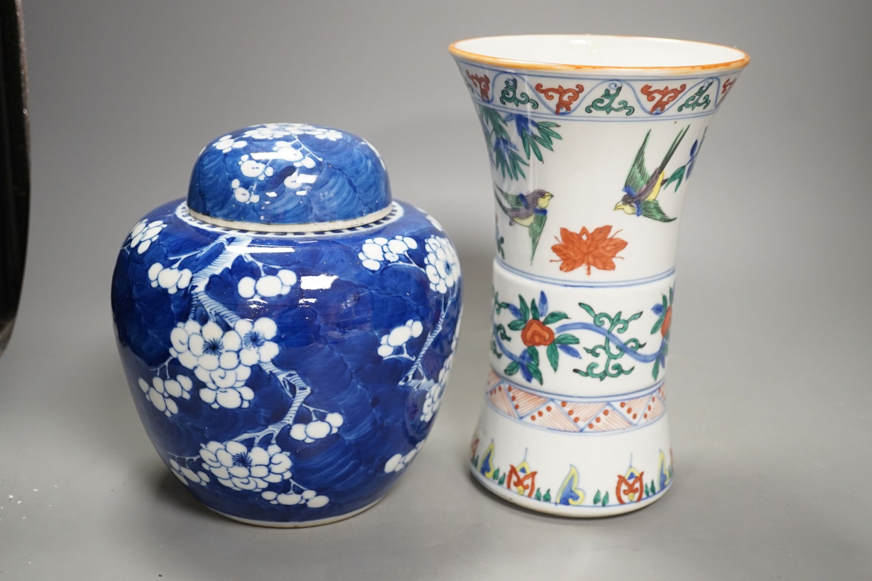 A Chinese prunus jar and cover, a polychrome vase and a famille rose jar, 24cms high.